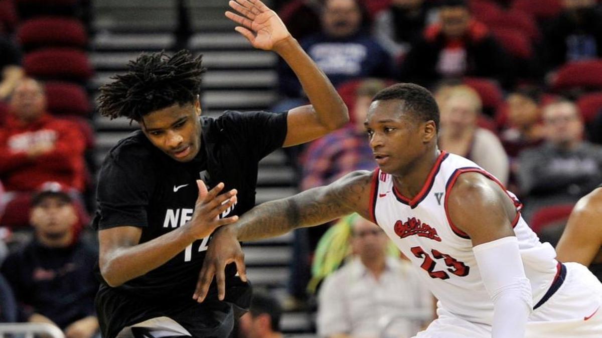 Fresno State senior guard Marvelle Harris makes a move around Nevada’s Lindsey Drew during the teams’ initial Mountain West matchup on Jan. 6 at Save Mart Center. Harris scored 18 points in an 85-63 victory and now awaits Saturday’s rematch in Reno, where a year ago he scored a career-high 40 in leading the Bulldogs to a 69-66 win.