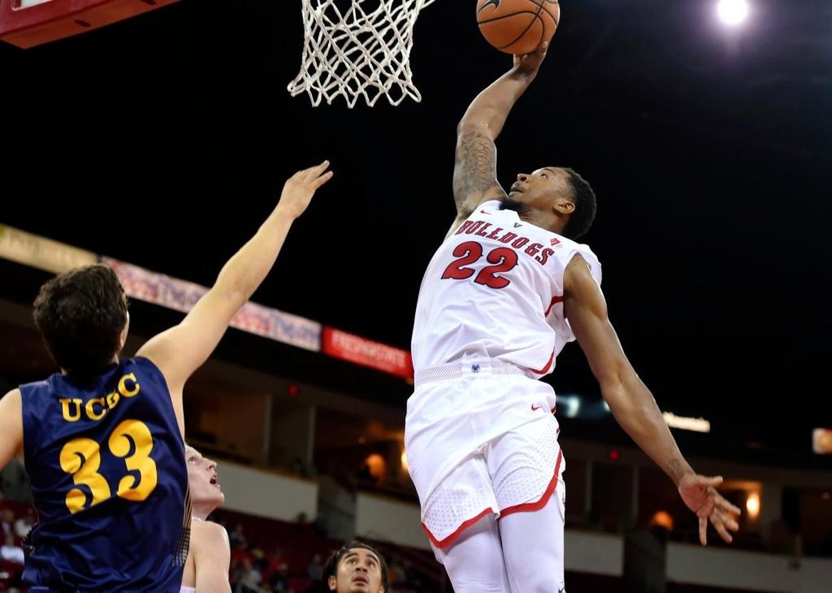 Fresno State forward Ray Bowles dunks over UC Santa Cruz’s Matthew Nerland in the Bulldogs’ 96-65 season-opening victory over the Banana Slugs on Nov. 10, 2017 in Fresno. Bowles, a graduate transfer from Pacific, is averaging 9.0 points, 1.5 rebounds and 3.0 assists over his first two games for the Bulldogs.