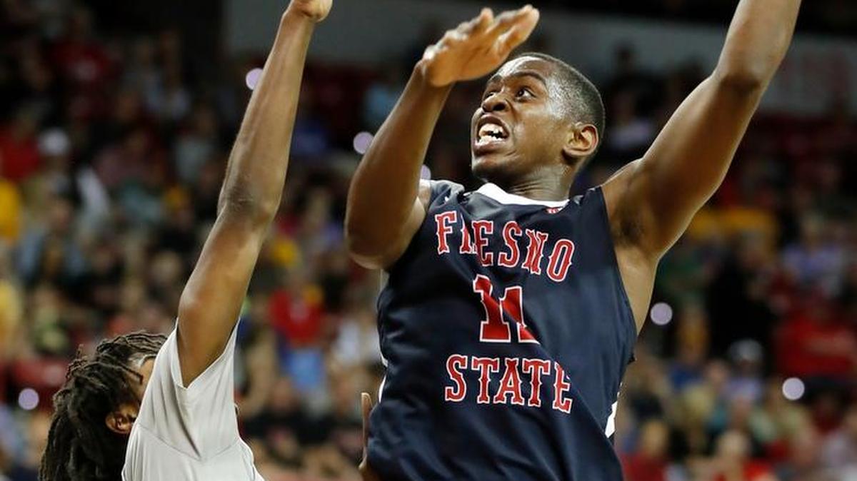 Fresno State freshman Bryson Williams shoots over Nevada’s Lindsey Drew in the semifinals of the Mountain West Conference Tournament Friday, March 10, 2017, in Las Vegas. Nevada defeated Fresno State 83-72. Williams is among many young players who can gain valuable experience with a trip to the NIT.
