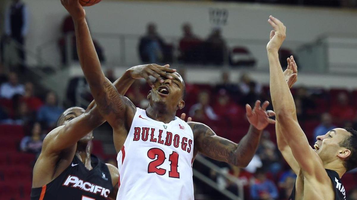 Fresno State guard Deshon Taylor, center, scored a game-high 24 points, but down starting point guard Noah Blackwell the Bulldogs struggled at the offensive end in a 74-65 loss at Colorado State. Aside from Taylor and Nate Grimes, the Bulldogs were a combined 10 of 38, 26.3 percent.