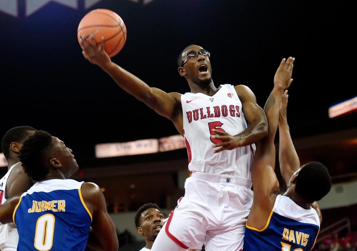 Fresno State senior Jahmel Taylor, center in action earlier this season, started in place of an injured point guard Jaron Hopkins in the Bulldogs’ 54-48 victory at Air Force on Monday, Feb. 26, 2018. He scored two points, had six rebounds and one assist for Fresno State, which has won six of its past seven games in Mountain West play.