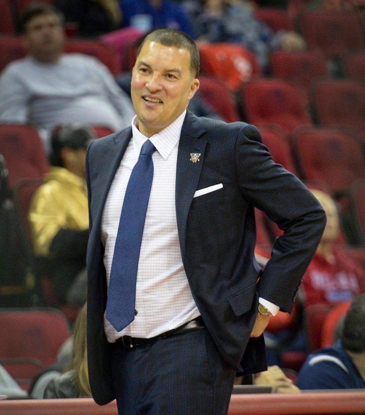 Fresno State coach Justin Hutson smiles as the Bulldogs mount a comeback against San Diego State in a 66-62 victory at the Save Mart Center on Tuesday, Jan. 22, 2019. The Bulldogs were down by 20 points in the first half.