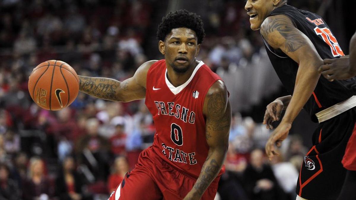 Fresno State’s Julien Lewis – at left driving around Pacific’s D.J. Ursery on Dec. 12, 2015 – is shooting 64.1 percent from the floor (25 of 39) in his past six games.