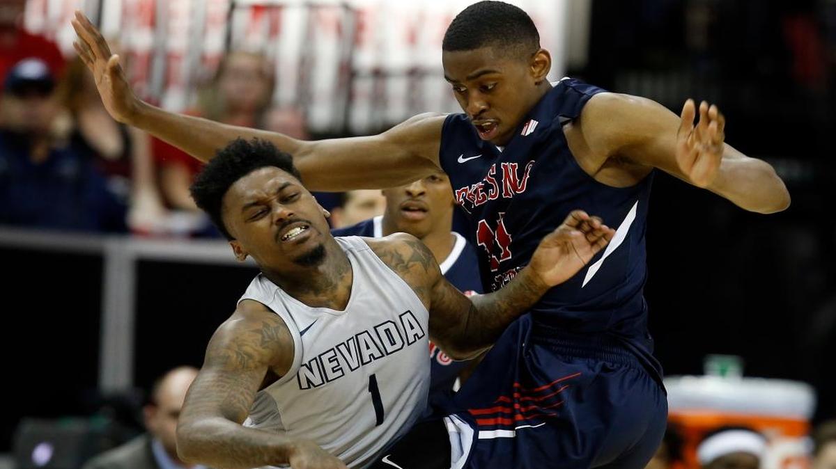 Fresno State freshman Bryson Williams cuts off Nevada guard Marcus Marshall on a drive to the basket in a semifinal game at the Mountain West Conference Tournament on Friday, March 10, 2017, in Las Vegas. Nevada defeated Fresno State 83-72.