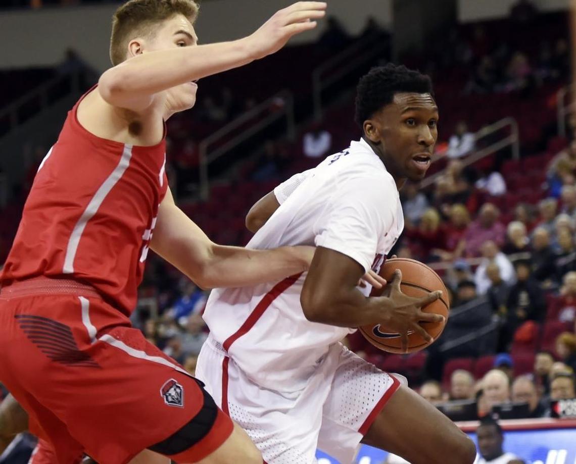 Fresno State point guard Jaron Hopkins, right, drives past New Mexico's Joe Furstinger, left, in thee Bulldogs’ 89-80 victory over the Lobos on Saturday, Jan. 13, 2018 in Fresno. The Bulldogs even their Mountain West Conference record at 3-3 with the victory.