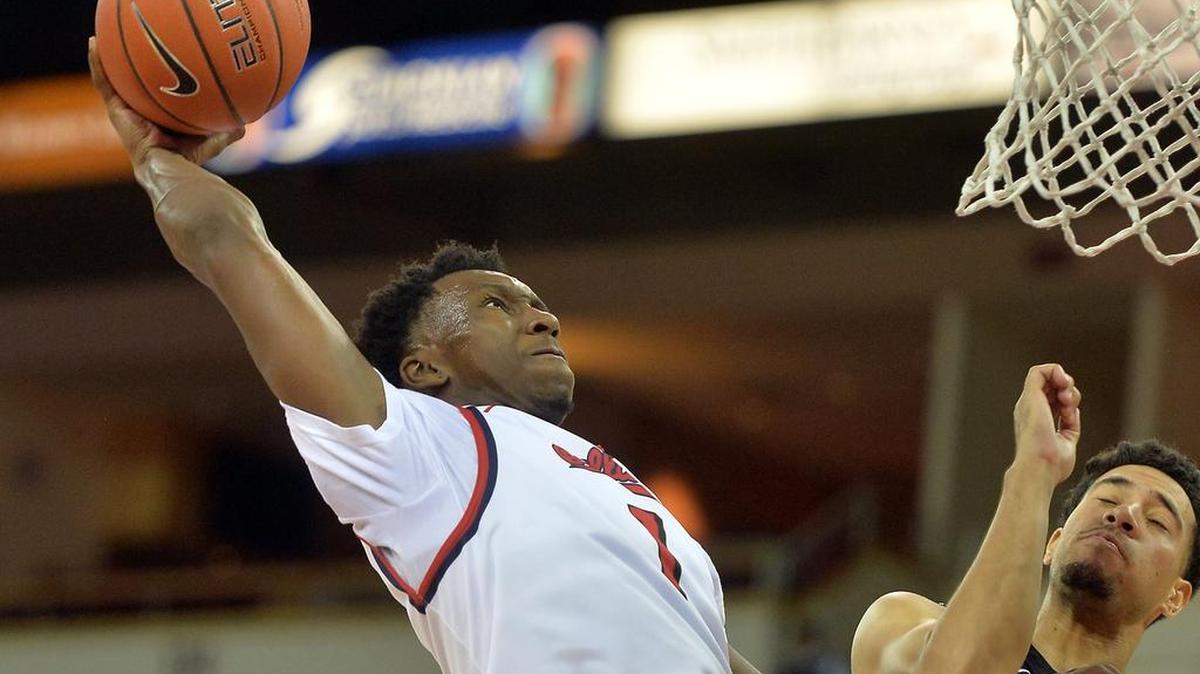 Fresno State’s Jaron Hopkins, left, goes up for two against Cal State San Bernardino’s Shawn Joseph in an exhibition game at Save Mart Center on Tuesday, Nov., 1, 2016, in Fresno.