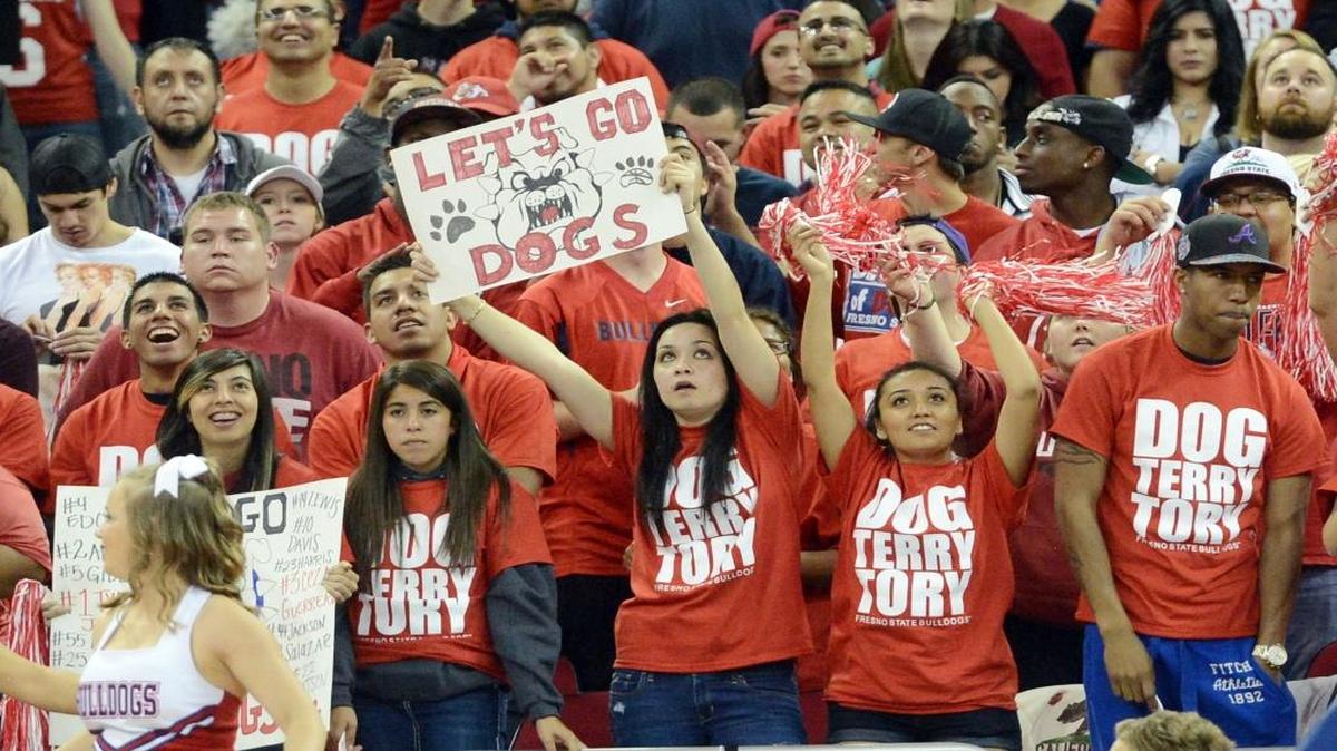Fresno State students watch the video board in the Save Mart Center in the final seconds of a 2014 game against Siena in the College Basketball Invitational finals. Fresno State will install a new high-definition video board in the arena by the end of the year.