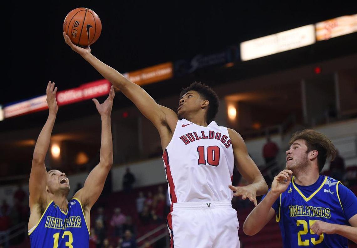Fresno State forward Orlando Robinson pulls down a rebound over UC Riverside’s Khy Kabellis, left, and Callum McRae, right, Saturday, Dec. 28, 2019 in Fresno.