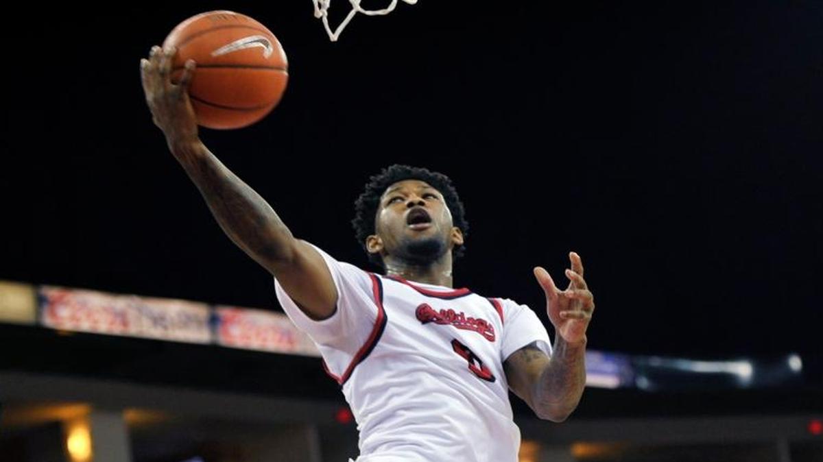 Fresno State’s Julien Lewis goes for the layup against San Diego State’s Trey Kell on Feb. 10 at Save Mart Center. An announced crowd of 6,476 turned out to see the Bulldogs spring a 58-57 upset.