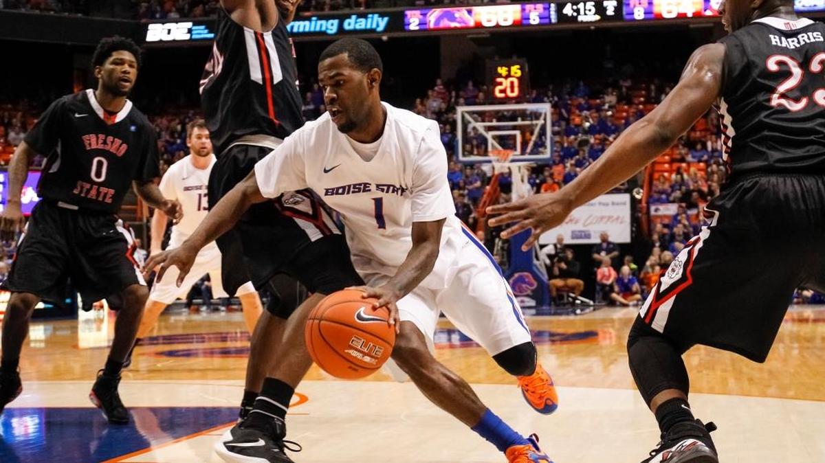 Boise State’s Mikey Thompson dribbles around Fresno State’s Torren Jones during a Jan. 9 game in Boise, Idaho.
