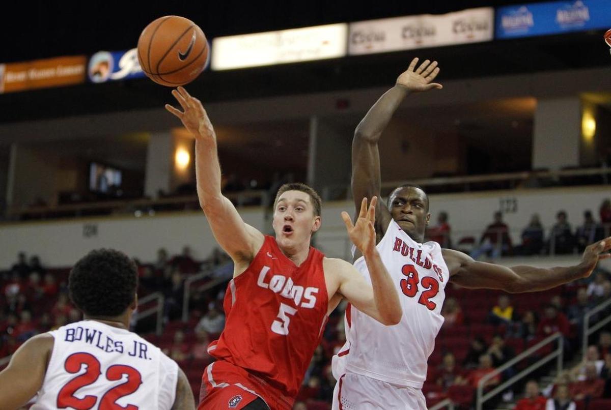 Fresno State forward Nate Grimes defends the paint as New Mexico’s Joe Furstinger looks to dump off a pass in the Bulldogs’ 89-80 victory over the Lobos on Saturday, Jan. 13, 2018, at the Save Mart Center. Grimes hit all seven of his shots in scoring a career-high 15 points in a victory at San Diego State.