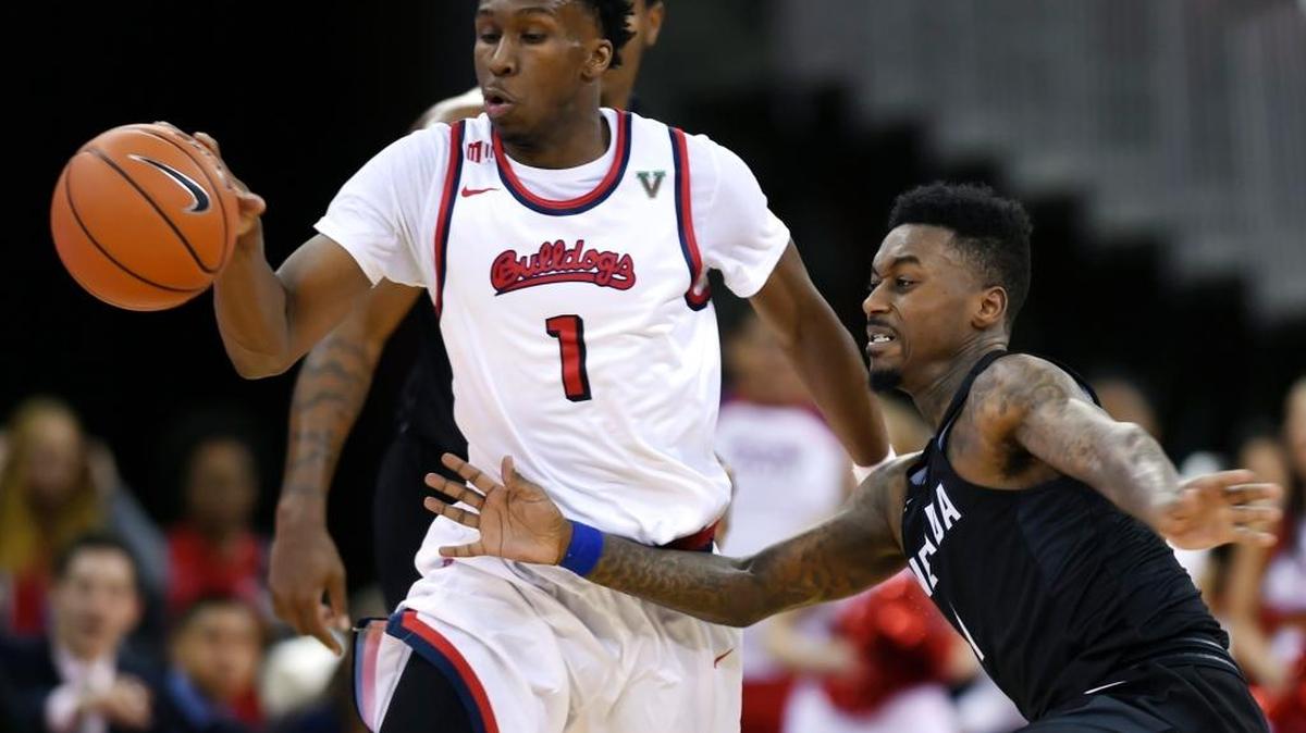 Fresno State point guard Jaron Hopkins, left, steps in front and steals a pass to Nevada's Marcus Marshall, right, late in second period action Saturday evening, Dec. 31, 2016 in Fresno, Calif. Fresno State held the lead for a 77-76 win against the Wolf Pack.