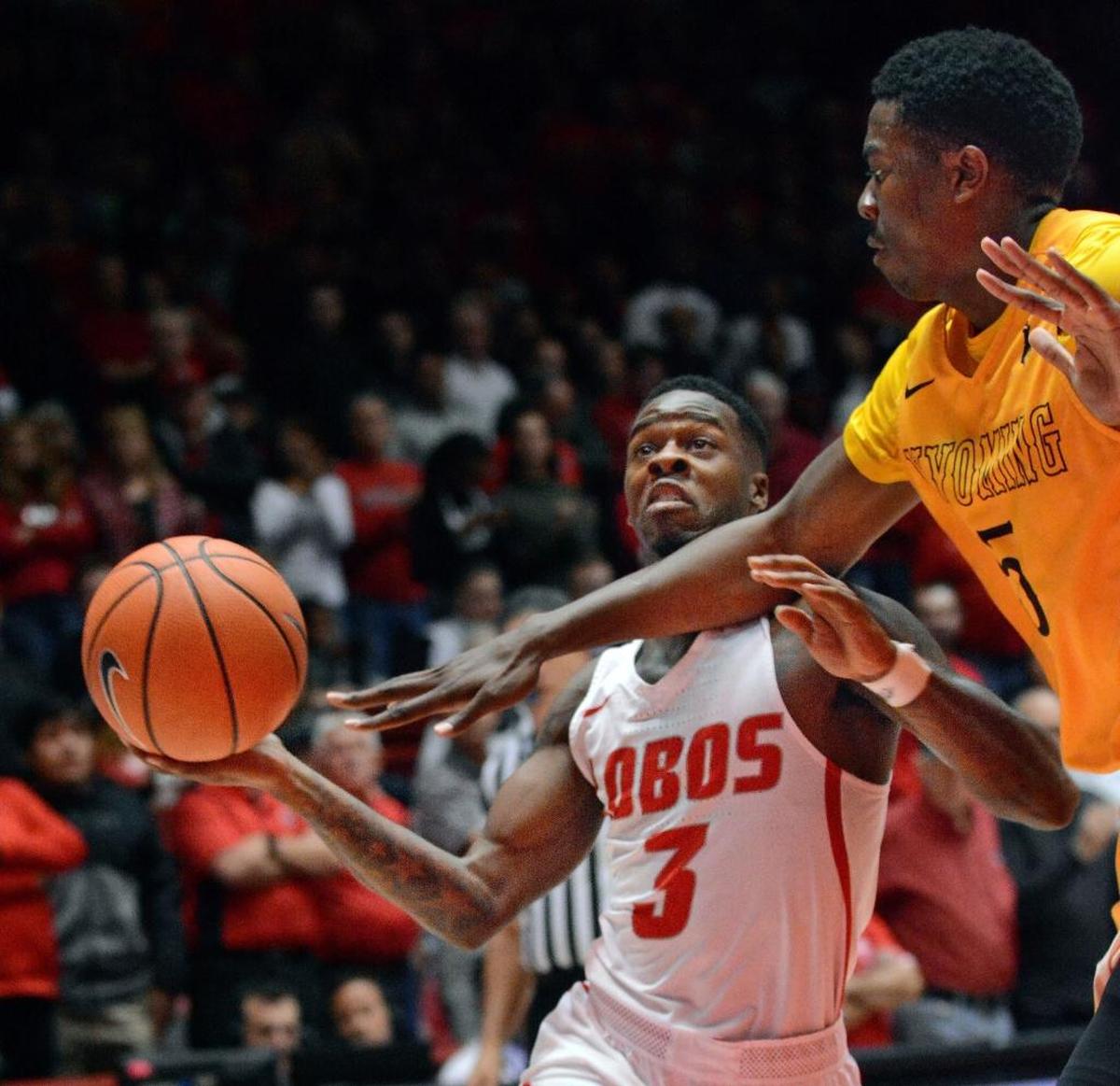New Mexico guard Antino Jackson drives against Wyoming’s Alan Herndon during the Lobos’ 75-66 victory over the Cowboys in Albuquerque, N.M., Wednesday, Jan. 10, 2018. The Lobos won despite turning over the ball 20 times.