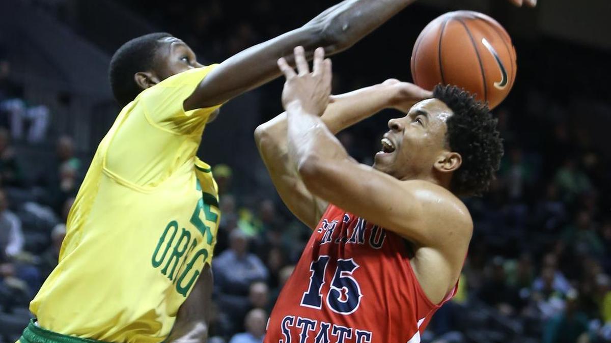Oregon’s Chris Boucher, left, blocks a shot attempt by Fresno State’s Lionel Ellison III during the first half Monday, Nov. 30, 2015, in Eugene. Ellison, a junior guard and JC transfer, has played in all eight of the Bulldogs’ games this season, averaging 21 minutes per contest.
