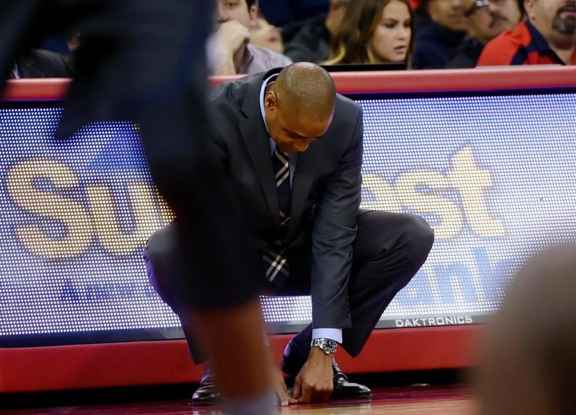 Fresno State coach Rodney Terry drops his head in frustration during the Mountain West home opener against Nevada. Despite 20 wins in four of the past five seasons, fan attendance at Save Mart Center dipped to the lowest levels in the arena's 15-year history.