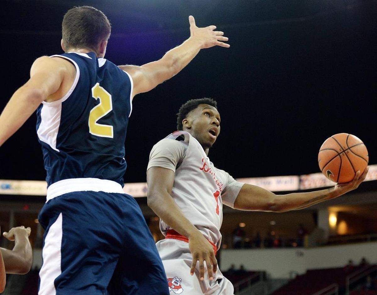 Fresno State point guard Jaron Hopkins, right, is rounding back to form after missing four games due to a back injury before the start of Mountain West play. In the Bulldogs’ 77-73 victory at San Diego State, Hopkins had six points, seven rebounds, three assists and three steals.
