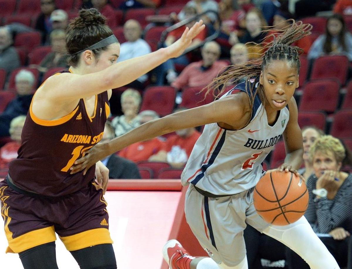 Fresno State guard Raven Johnson drives by Arizona State’s Robbi Ryan in the first half of the Bulldogs’ 81-49 loss to the Sun Devils on Wednesday, Nov. 15, 2017, at Save Mart Center.