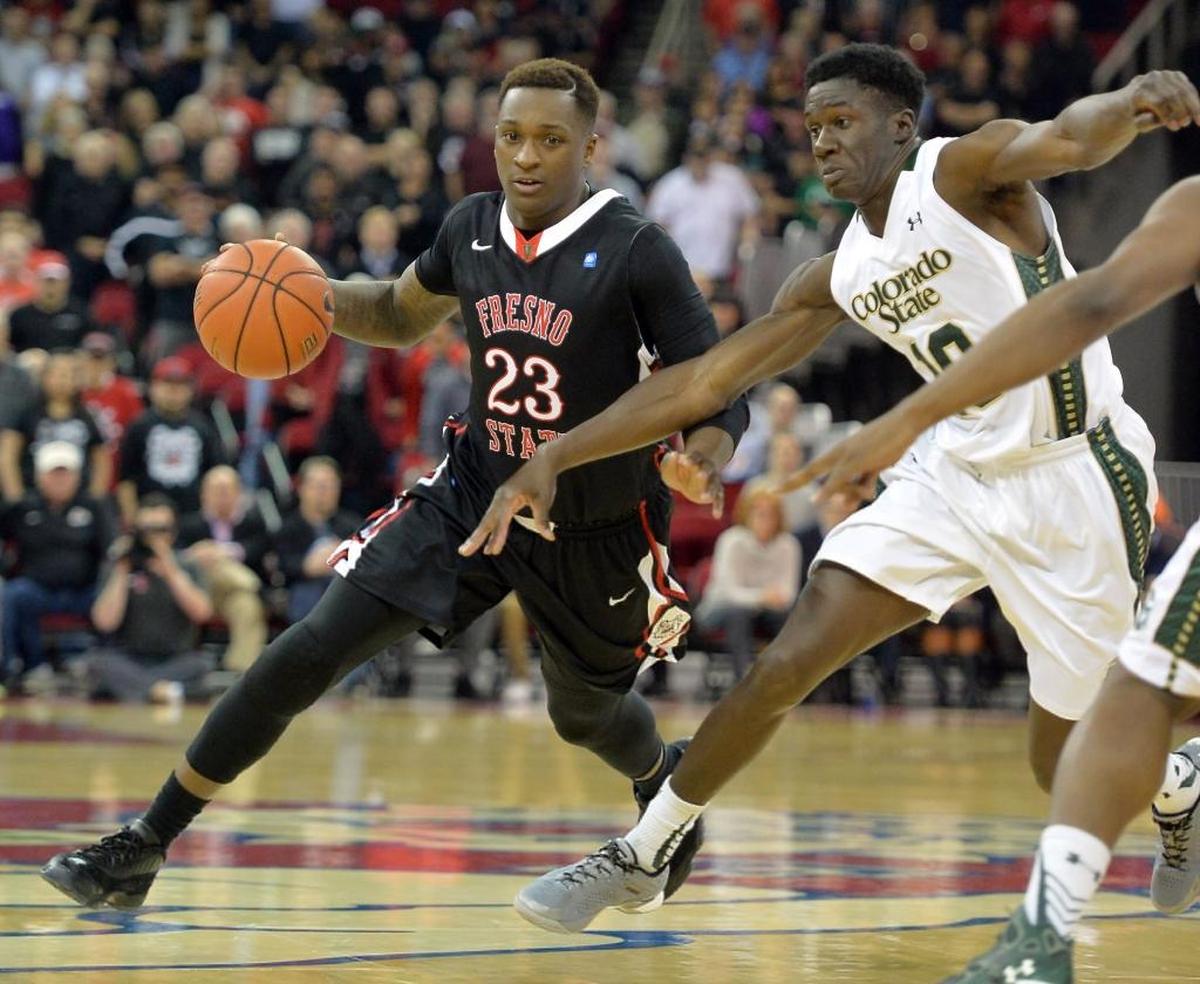 Fresno State guard Marvelle Harris, left, was a key piece in building the Bulldogs’ basketball program. Harris ended his four years at Fresno State as the school’s all-time leading scorer and as a senior in 2016 led the Bulldogs to their first NCAA Tournament since 2001.