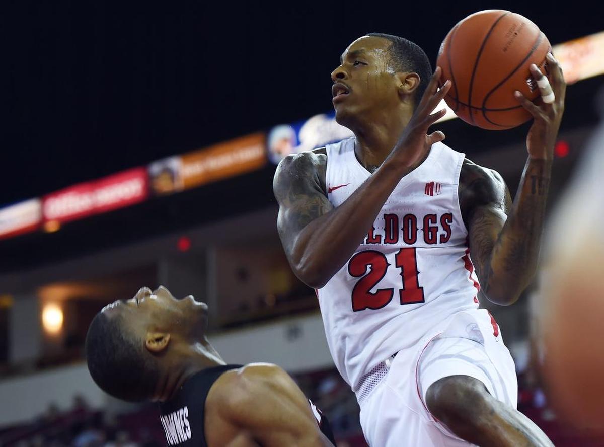 Fresno State guard DeShon Taylor drives to the basket in the Bulldogs’ victory over Pacific. Taylor, a first-team all-conference selection, will be sidelined for four to six weeks with an elbow injury.