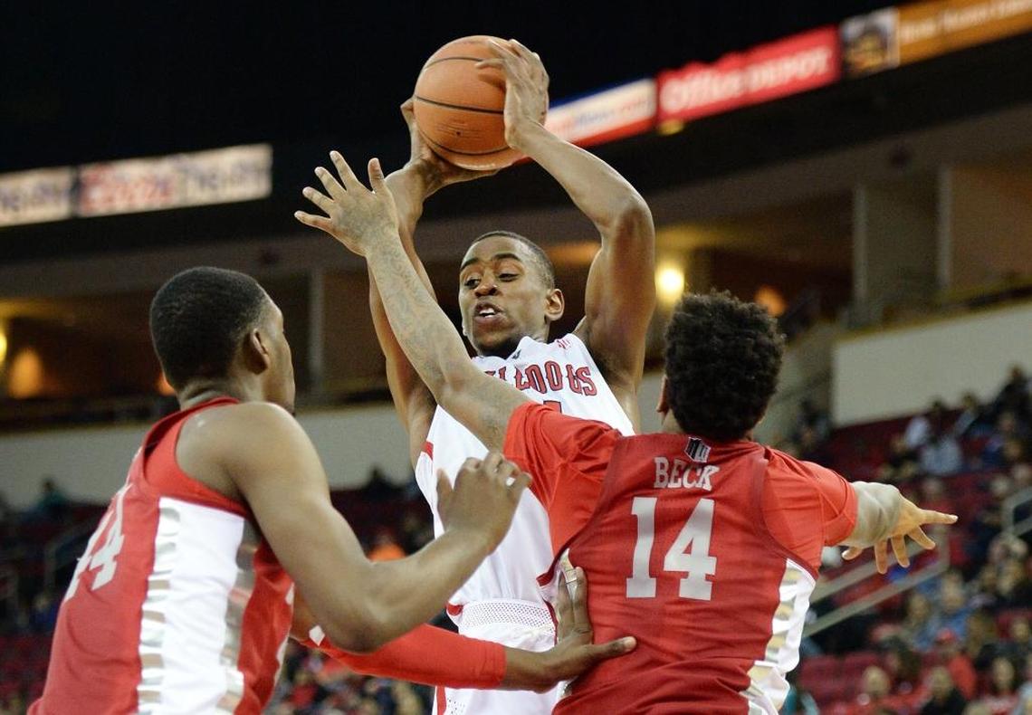 Fresno State forward Bryson Williams, center, looks to pass with UNLV’s Brandon McCoy, left, and Tervell Beck defending in the first half of the Bulldogs’ 69-63 victory at the Save Mart Center in Fresno on Tuesday, Jan. 23, 2018. Williams scored a game-high 20 points and also had a career-high four assists, all of them going to center Terrell Carter II.