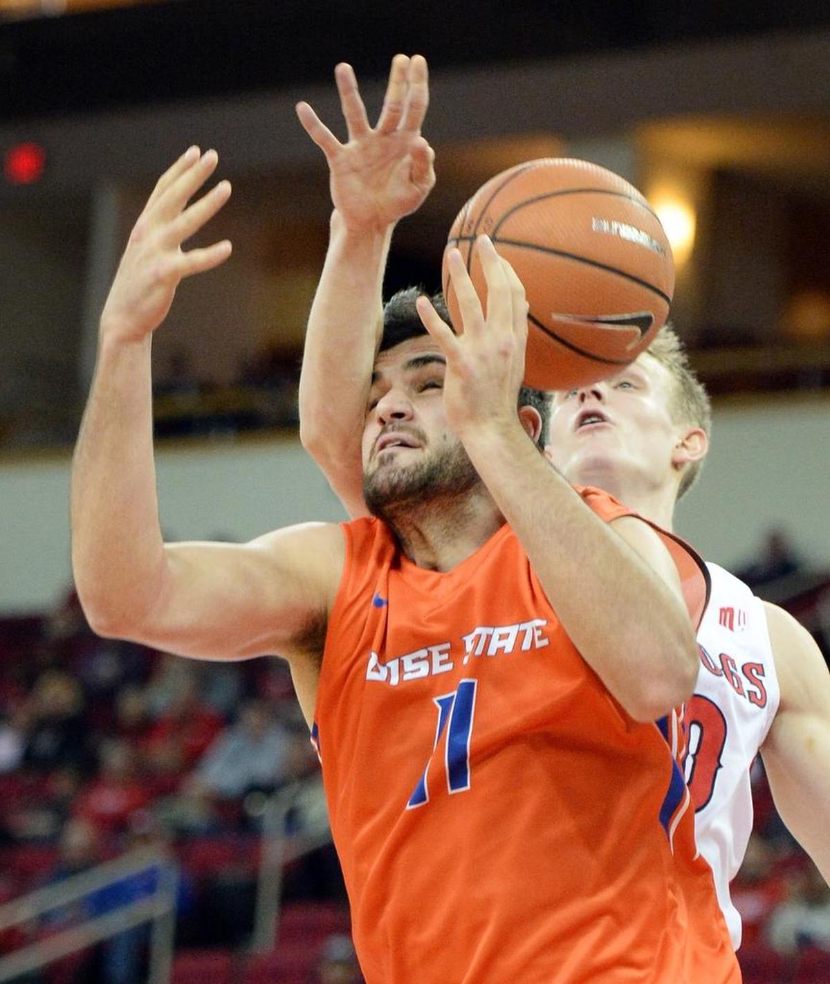 Boise State forward Zach Haney (11) tries to take a rebound away from Fresno State forward Sam Bittner during the Bulldogs’ 70-64 loss to the Broncos at the Save Mart Center in Fresno on Tuesday, Jan. 9, 2018. Bittner didn’t score in the game, but had six rebounds and three assists.