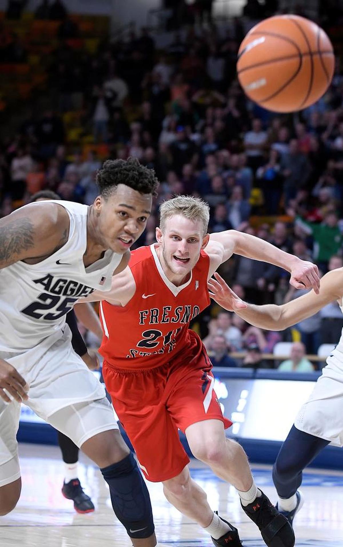 Fresno State forward Sam Bittner goes after a loose ball with Utah State forward Dwayne Brown Jr. during the Bulldogs’ 81-79 overtime loss Wednesday, Jan. 3, 2018, in Logan, Utah. The Bulldogs averaged 8.6 steals in their first 13 games, but in three Mountain Weest games have averaged 3.0.