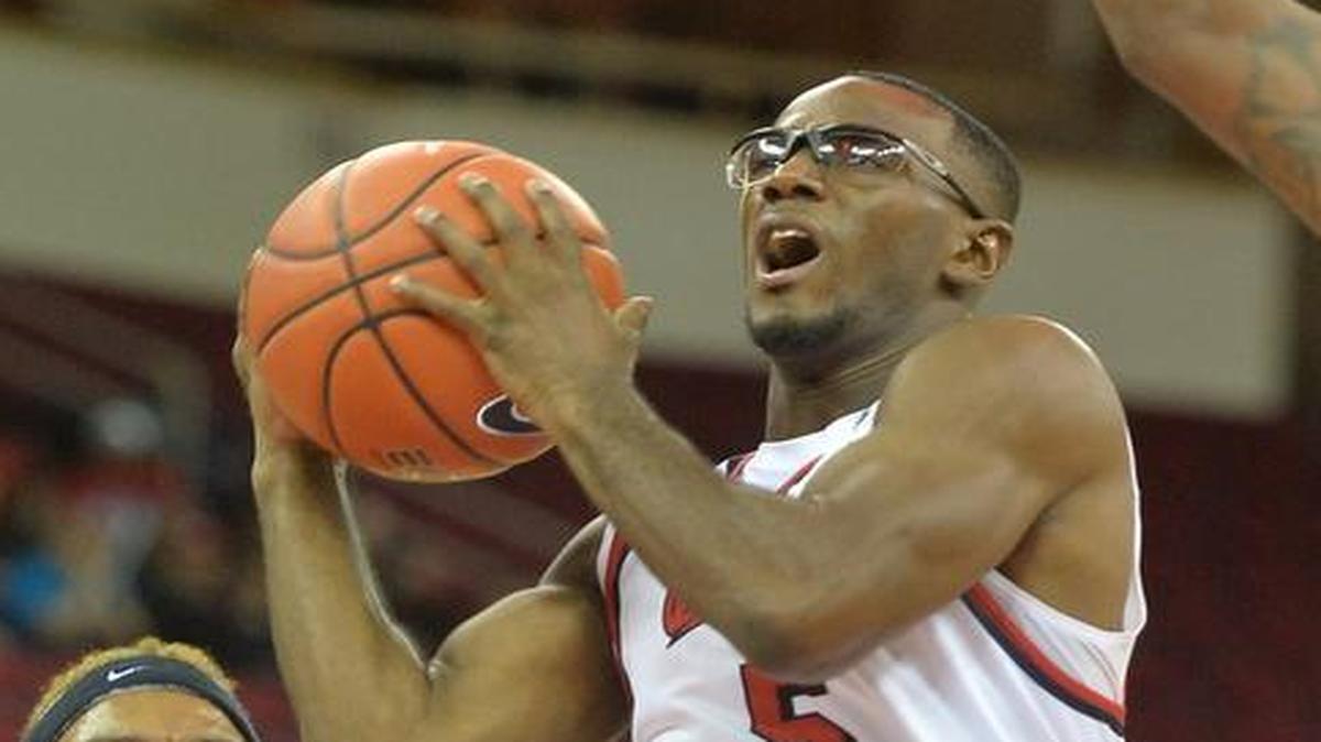 Fresno State guard Jahmel Taylor, right, drives to the basket in an exhibition victory over Cal State San Bernardino at Save Mart Center on Tuesday, Nov., 1, 2016. Taylor is wearing prescription goggles this season and it has paid off – he has hit 16 of 28 3-pointers, ranking second in the Mountain West with a shooting percentage of 57.1.