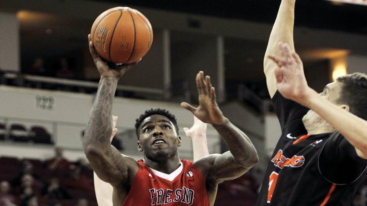 Fresno State’s Torren Jones, at left putting up a shot while guarded by Pacific’s Tonko Vuko on Dec. 12, 2015, will return to the Bulldogs’ starting lineup for their game at Mountain West-leading San Diego State on Tuesday, Jan. 19, 2016.