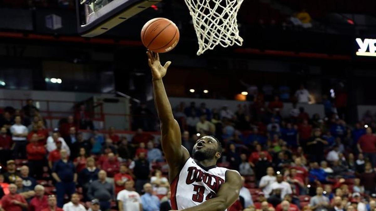 UNLV’s Ike Nwamu shoots against Air Force’s Danny Hummer during Wednesday’s first-round game at the Mountain West Conference Tournament in Las Vegas. Nwamu scored 38 points as the Runnin’ Rebels won 108-102 in triple overtime to advance to a Thursday quarterfinal against Fresno State.