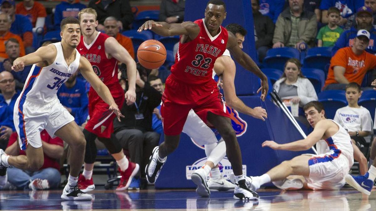 Fresno State forward Nate Grimes chases down a loose ball with Boise State’s Alex Hobbs in pursuit Saturday, Jan. 19, 2019 at Taco Bell Arena in Boise.
