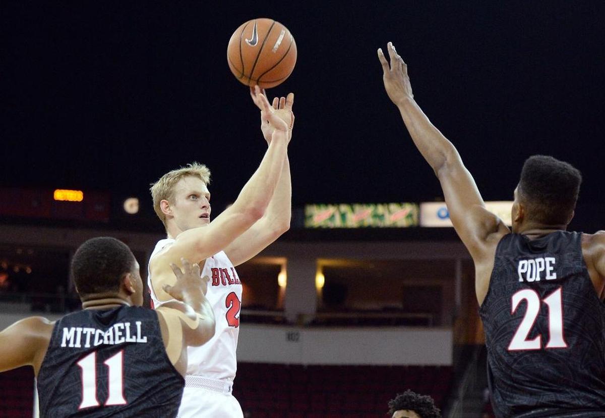 Fresno State forward Sam Bittner takes a jump shot over San Diego State’s Malik Pope, right, in the Bulldogs’ 79-61 victory over the Aztecs at the Save Mart Center in Fresno on Tuesday, Feb. 6, 2018. Bittner hit four of five shots in scoring nine points for the Bulldogs, who hit 52.5 percent of their shots in the win.