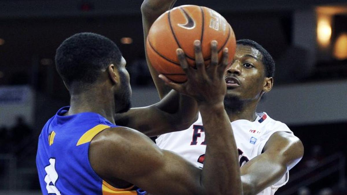 Fresno State’s Paul Watson, right, covers San Jose State’s Brandon Mitchell during their game last season at Save Mart Center. Watson has been playing the three at times for the Bulldogs this season and “he has done well,” coach Rodney Terry said, adding: “The next phase is he’s learning how to use his length, so he doesn’t have to always feel like he has to crowd a guy. He can use his length. He’s 6-7. He’s a long dude on the perimeter.”