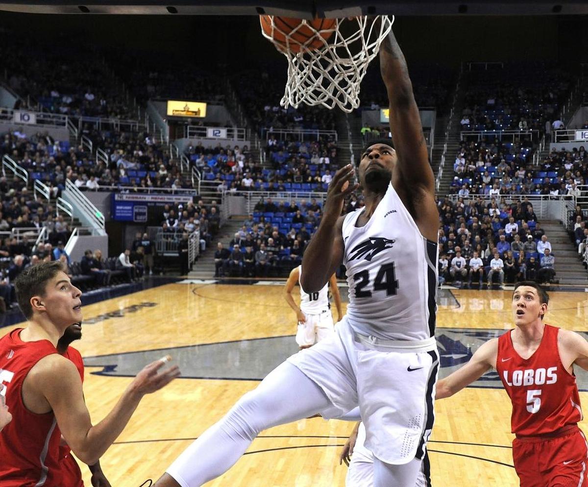 Nevada forward Jordan Caroline (24) dunks against New Mexico in the Wolf Pack’s 77-74 victory over the Lobos. Caroline had 13 points and seven rebounds when Nevada won at Fresno State 80-65 on Dec. 27, 2017.