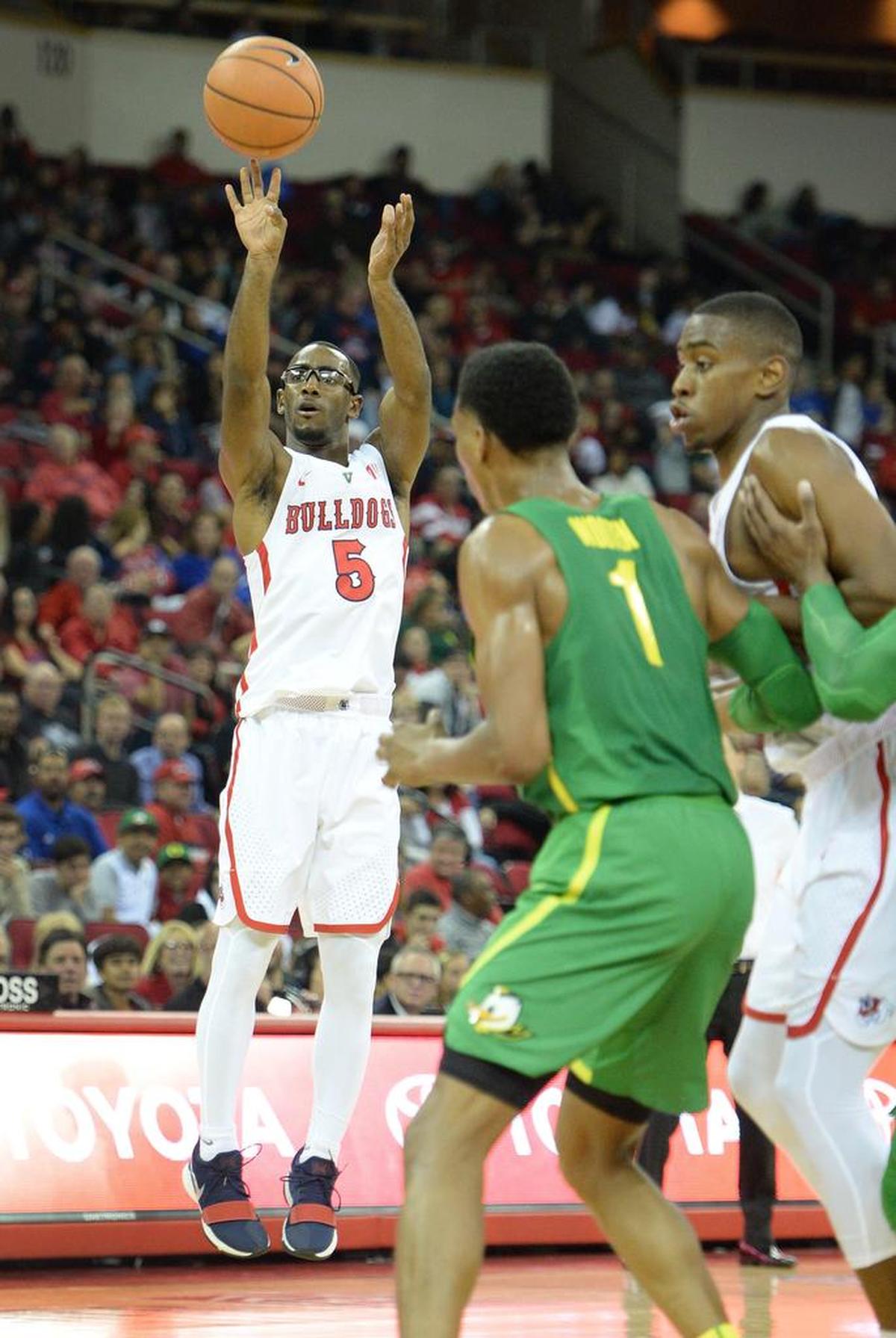 Fresno State guard Jahmel Taylor, center, put foul trouble aside in the Bulldogs’ 95-86 loss in overtime at New Mexico on Saturday, March 3, 2018, scored 16 of his 23 points in the second half. Taylor hit 5 of 5 shots in the final six minutes of regulation including four from the 3-point line.