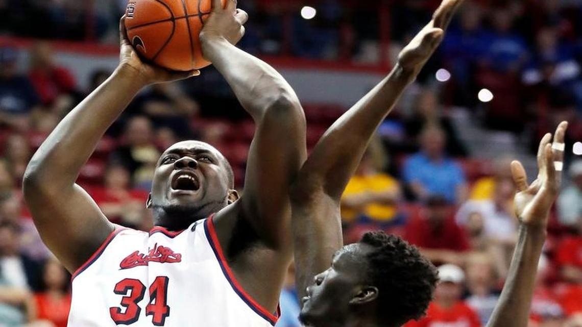 Fresno State’s Terrell Carter Jr. shoots as New Mexico’s Obij Aget defends at the Mountain West Conference Tournament on Thursday, March 9, 2017, in Las Vegas.