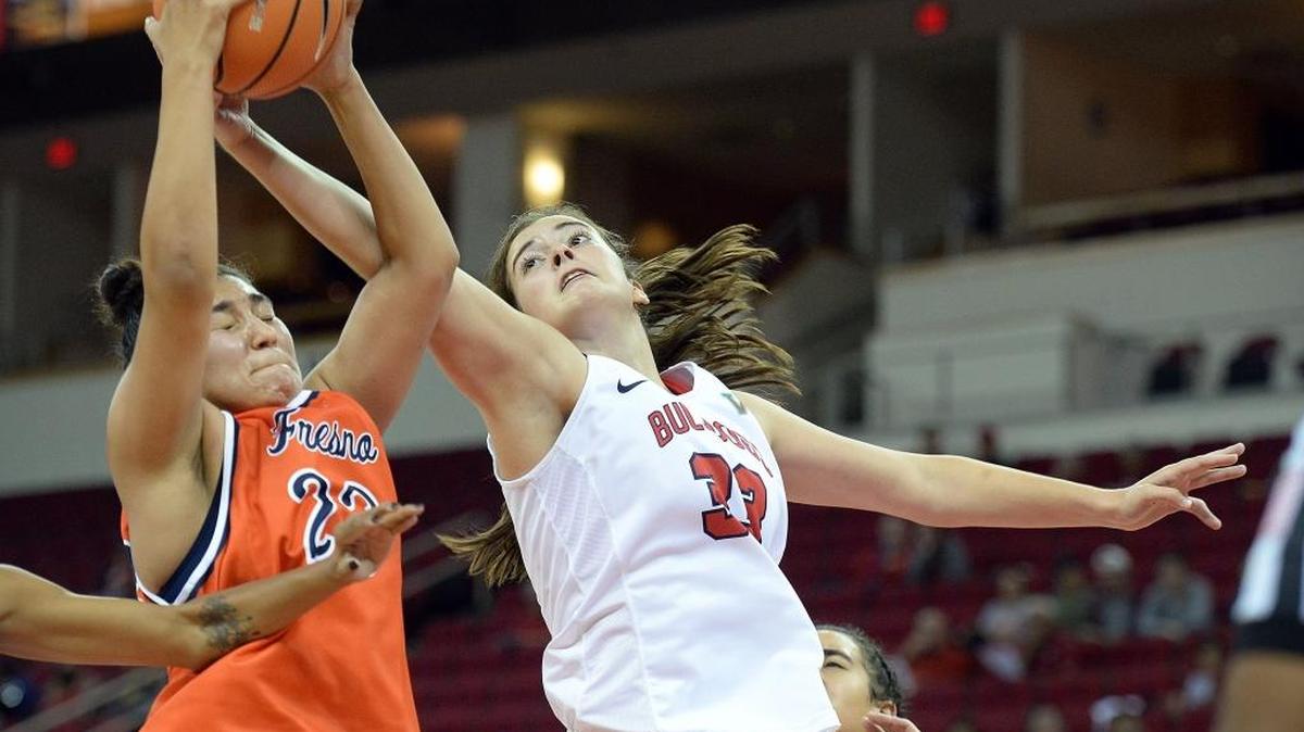 Fresno State’s Megan Nilsson, right, fights Fresno Pacific’s Viviana Vasquez for a rebound during the first half of their exhibition game at the Save Mart Center on Friday, Nov. 3, 2017.