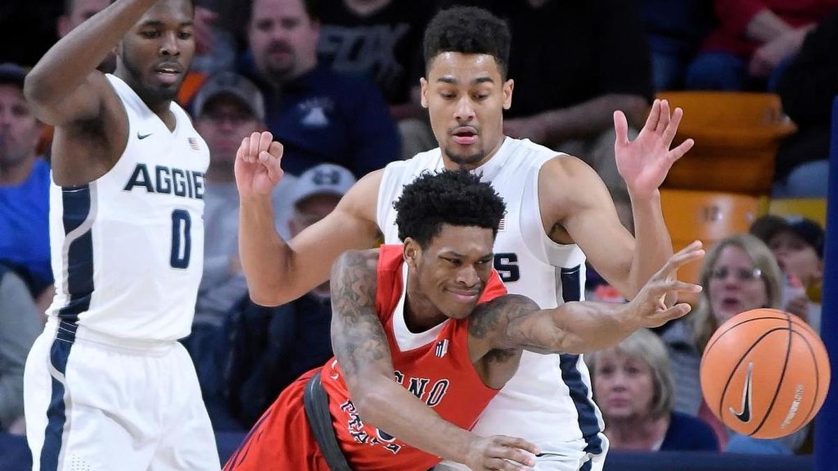 Fresno State guard New Williams loses the basketball as Utah State guard DeAngelo Isby (0) and forward Alex Dargenton defend during the Bulldogs’ 81-79 overtime loss to thee Aggies on Wednesday, Jan. 3, 2018, in Logan, Utah. Williams, a transfer from Auburn, played three minutes in his first game for the Bulldogs.