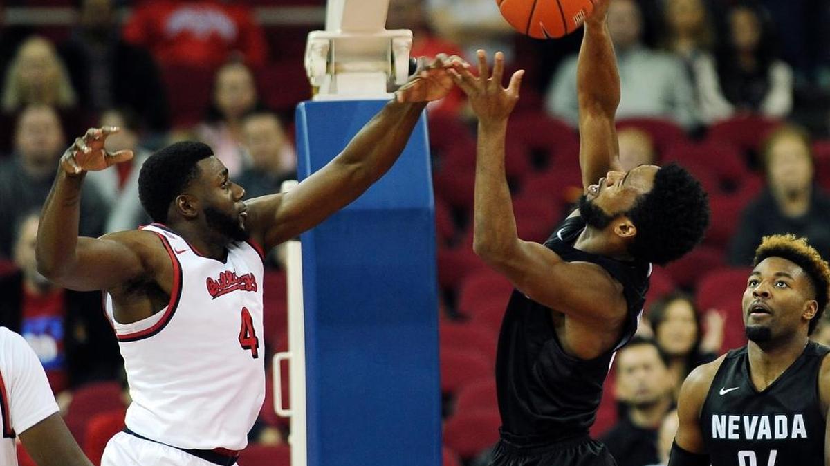 Fresno State senior Karachi Edo knocks a rebound away from Nevada’s D.J. Fenner in a 77-76 victory over the Wolf Pack on Dec. 31, 2016, that extended a remarkable run of success for the Bulldogs in close games.
