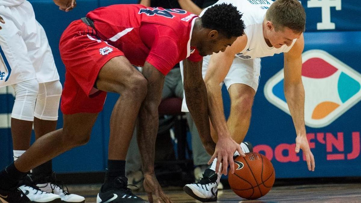 Fresno State forward Torren Jones, left, and Air Force guard Zach Kocur battle for a loose ball during the first half of Saturday’s game at Clune Arena in Colorado Springs, Colo. Fresno State won 56-55 on Jones’ putback with 5 seconds to play.