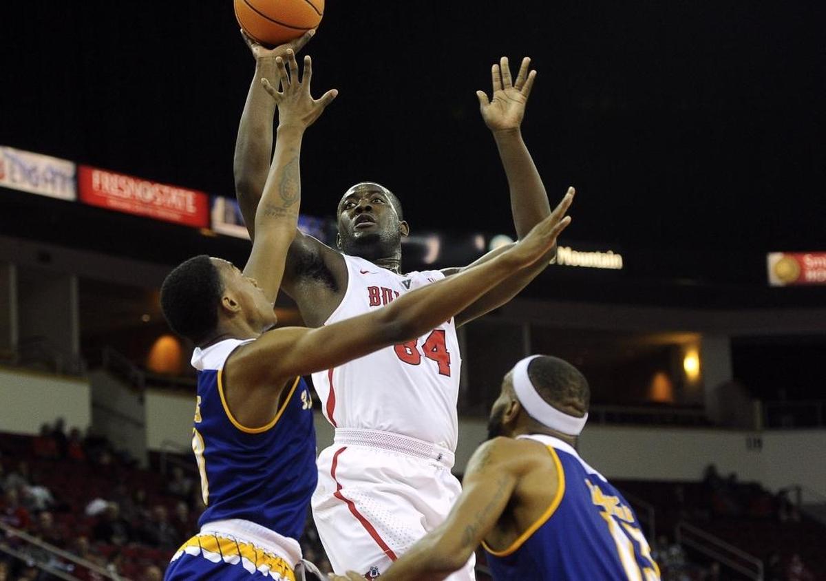 Fresno State center Terrell Carter II gets a shot up and over Bakersfield's Justin Davis, left, and Shon Briggs, right, in the Bulldogs’ 70-55 victory on Tuesday, Dec. 5, 2017 in Fresno.