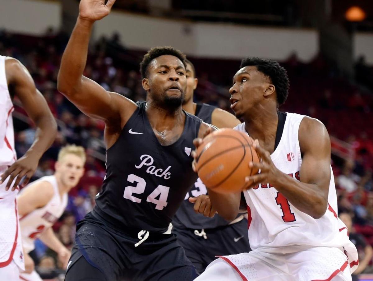 Fresno State point guard Jaron Hopkins tries to get around Nevada forward Jordan Caroline in the Bulldogs’ 89-65 loss to thee Wolf Pack in their Mountain West Conference opener Wednesday, Dec. 27, 2017 in Fresno. Hopkins, who missed the past four games with a back injury, played 22 minutes in his reeturn, scoring five points with eight rebounds and one assist.