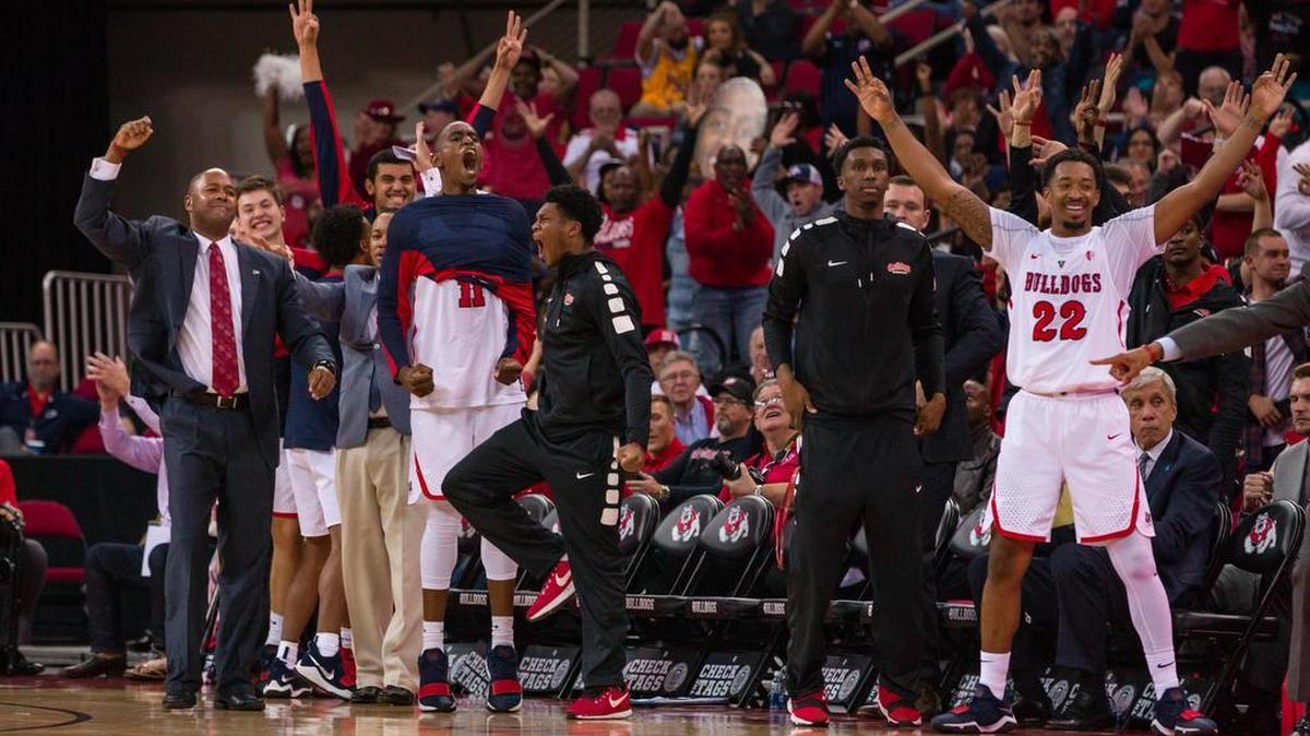 Fresno State interim basketball coach Byron Jones, far left, is charged with keeping a talented roster together as the athletic department searches for a coach after Rodney Terry bolted for Texas-El Paso. Jones, a Bulldogs’ assistant the past seven years, would like a shot at a promotion.