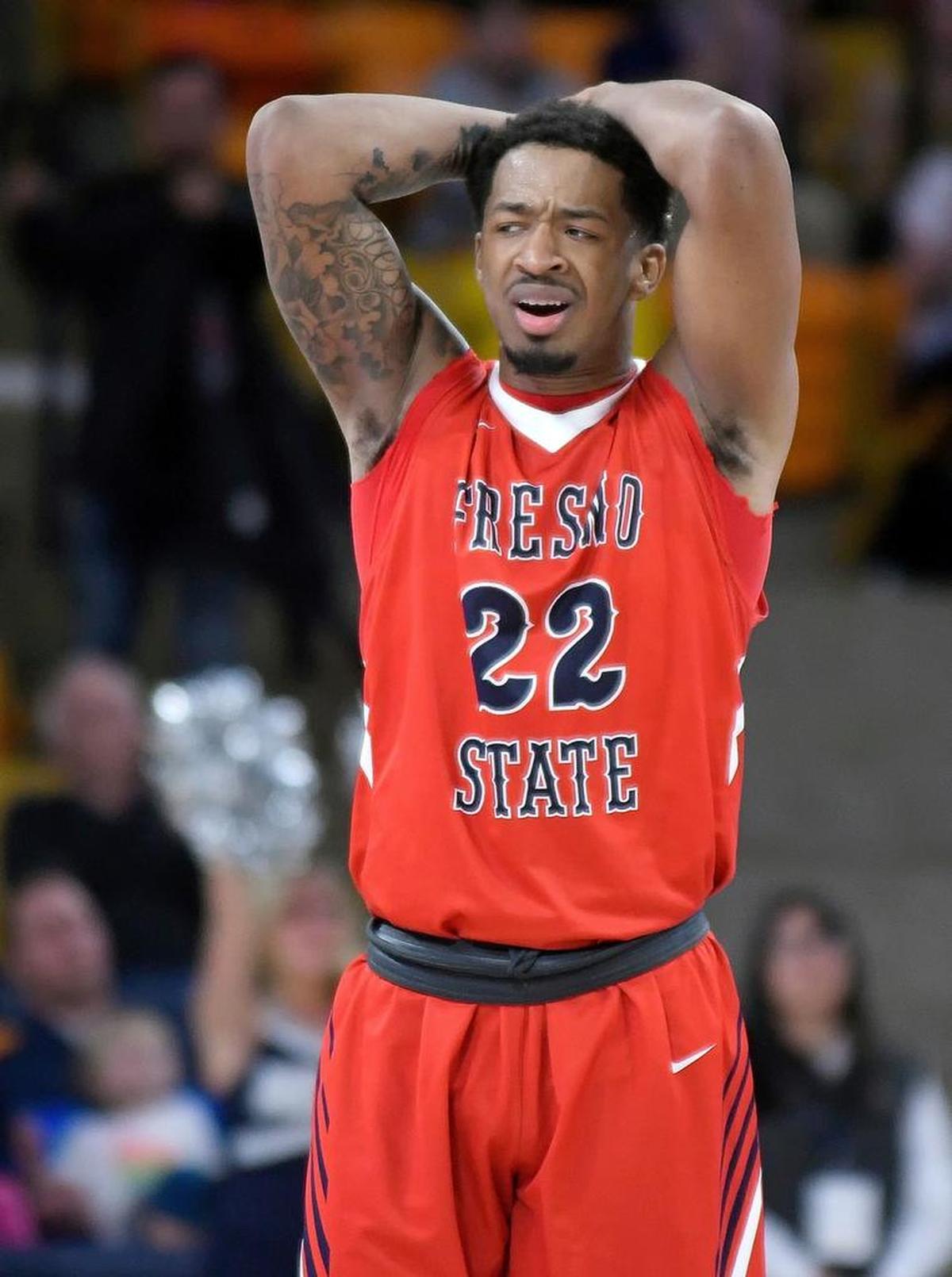 Fresno State forward Ray Bowles Jr. reacts after teammate Deshon Taylor fouled Utah State’s Koby McEwen in the final second of the Bulldogs’ 81-79 loss to the Aggies on Wednesday, Jan. 3, 2018, in Logan, Utah. McEwen made one free throw to send the game to overtime.