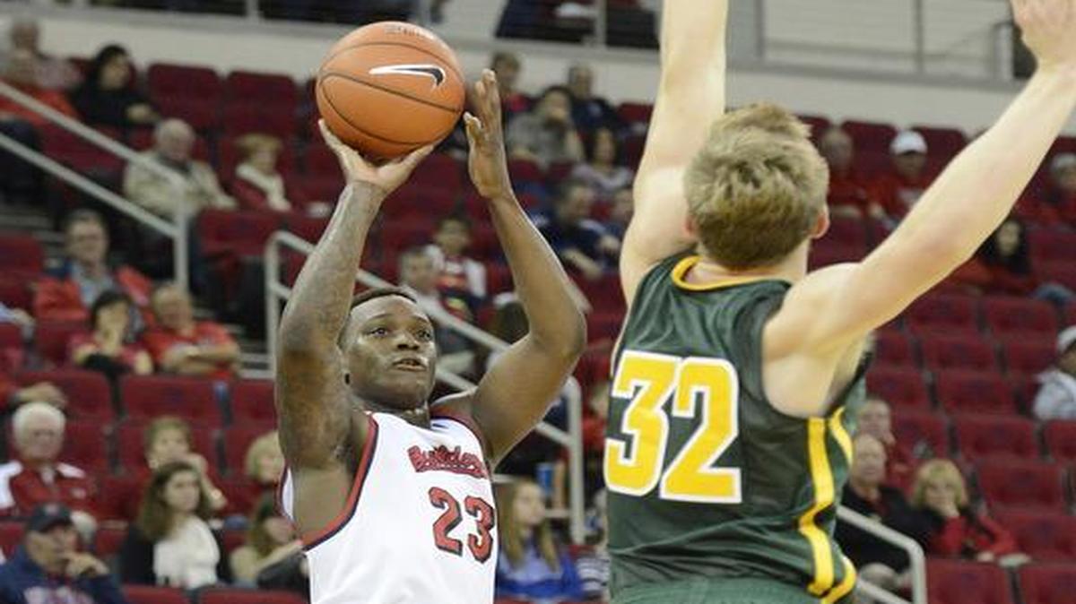 Fresno State’s Marvelle Harris takes a three-point shot while defending by San Francisco’s Tim Derksen on Nov. 19, 2015, at Save Mart Center. Harris is shooting 27.4 on three-pointers this season, well off last year’s 32.1 not to mention his 35.9 rate from 2013-14.