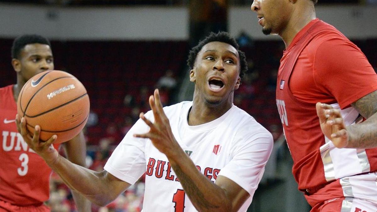 Fresno State point guard Jaron Hopkins, center, hit 9 of 11 shots and had 19 points, six rebounds and five assists in only 23 minutes when the Bulldogs won 81-76 at Nevada last season. In four career games against the Wolf Pack, he is 21 of 41 in scoring 50 points with 24 rebounds and 16 assists.