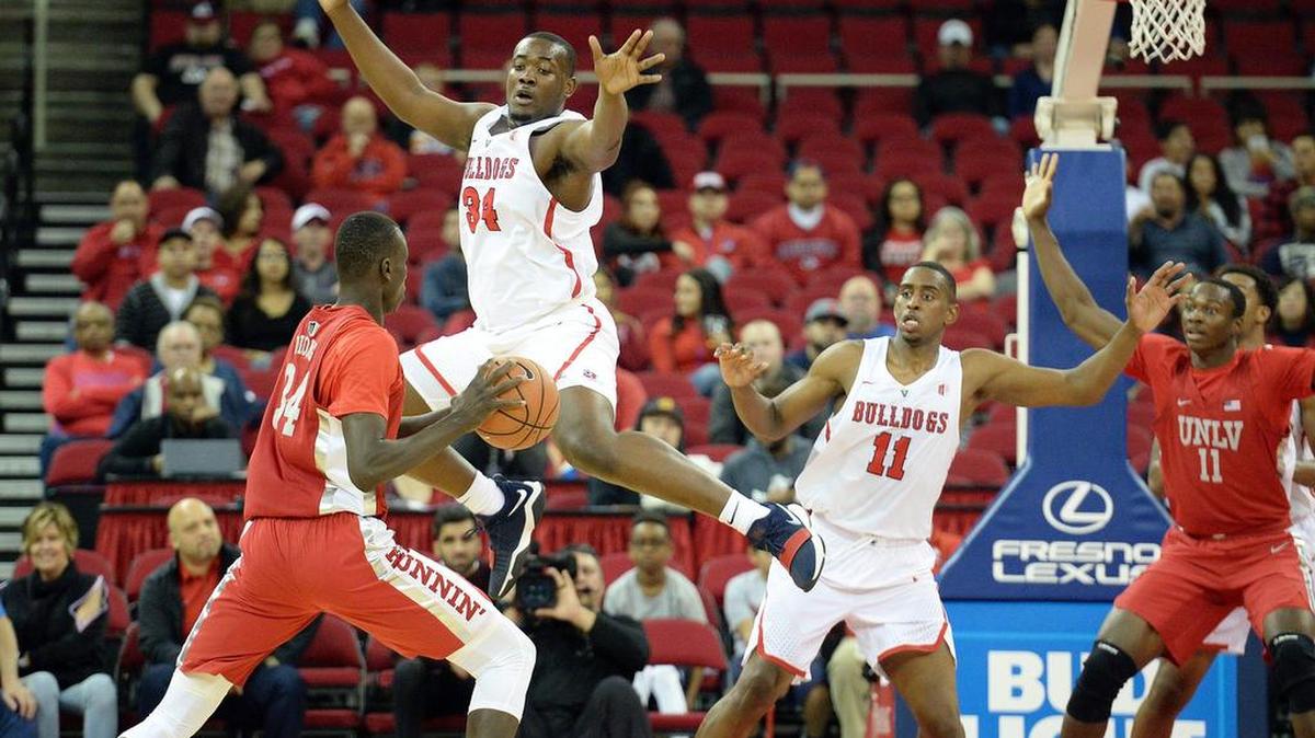 Fresno State center Terrell Carter II, center, applies defensive pressure in a victory over UNLV. The Bulldogs have struggled at the defensive end since losing point guard Jaron Hopkins to a right foot injury. In a 95-86 loss at New Mexico on Saturday, March 3, 2018, the Lobos hit 53.7 percent of their shots and got to the foul line 31 times.