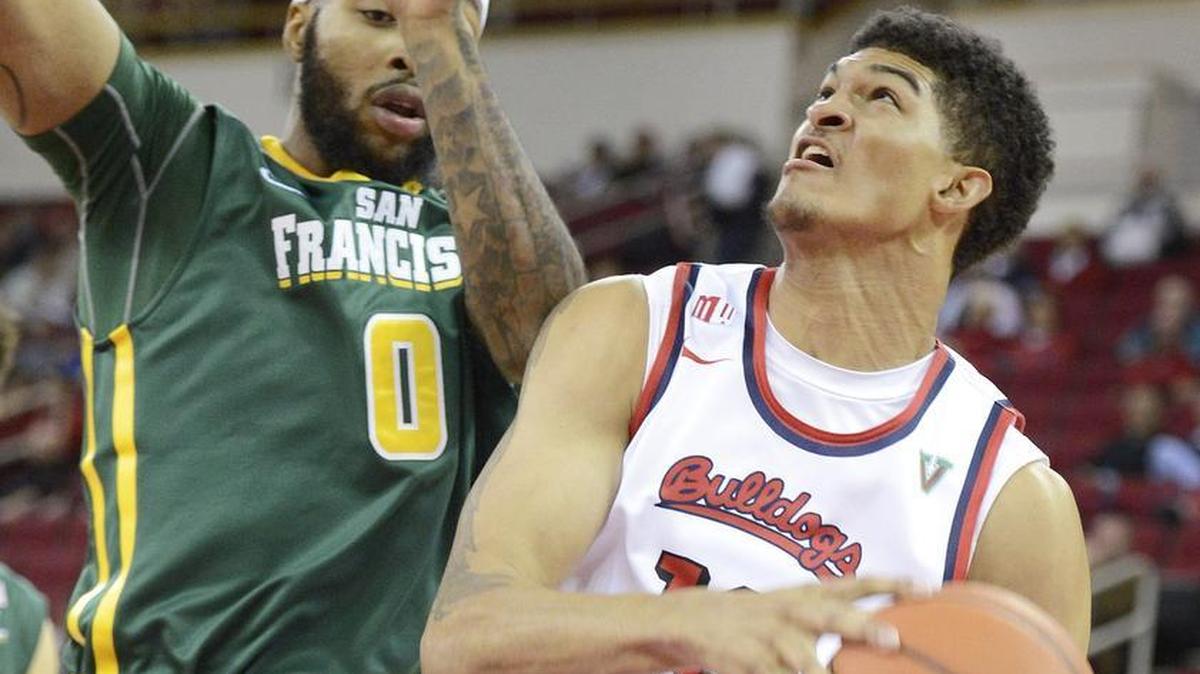 Fresno State’s Cullen Russo drives under the hoop against San Francisco’s Montray Clemons during the Bulldogs’ victory at Save Mart Center on Nov. 19, 2015. The Bulldogs visit Rice in Houston on Sunday, seeking to extend their unbeaten start to the season.