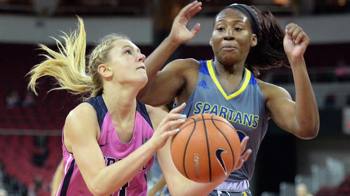 Fresno State’s Maddi Utti, left, eyes the hoop for a shot last season against San Jose State.