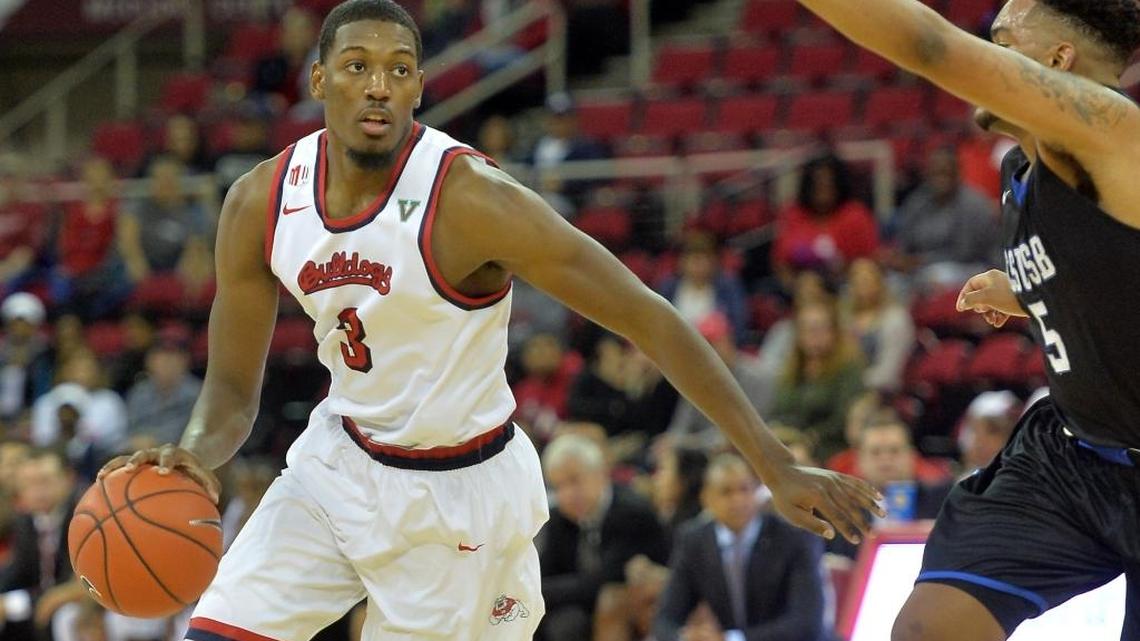 Fresno State’s Paul Watson gets past Cal State San Bernardino’s Blake McBride in an exhibition Tuesday, Nov., 1, 2016, at Save Mart Center. Heading into the 2016-17 season, the Bulldogs will again count on the versatility of the now senior who has shown his ability to slide between the three and four positions on the court.