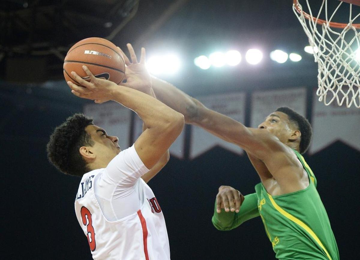 Fresno State guard Johnny McWilliams tries to get a shot past Oregon’s Kenny Wooten on Saturday, Dec. 16, 2017, at Save Mart Center. Wooten had six blocks in the Ducks’ 68-61 victory.